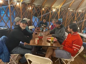 trail runners sitting around talking at Sundog Running High Altitude Trail camp in Flagstaff, Arizona