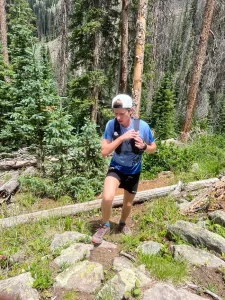 Jared Hazen utilizing a pack, loaded up with hydration and fuel, running up Pagosa Peak in Colorado